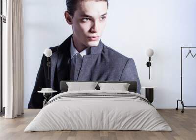 Male model wearing fashionable clothing. Fashion studio portrait.  Wall mural