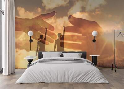 Man and woman helping each other working together as a team in unity. People teamwork concept.  Wall mural