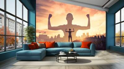 Mental, and physically strong woman in the city. Inner strength and feeling motivated concept.  Wall mural