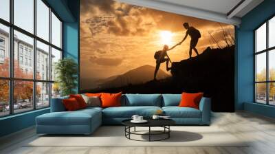 people helping each other up a mountain. adventure, taking risk, and teamwork concept. Wall mural