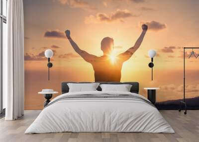 People power! Silhouette of strong man with arms outstretched. Motivated, empowered wellness concept.  Wall mural