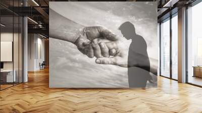 Sad and depressed man in need of help and support. Giving a helping hand and salvation concept.  Wall mural