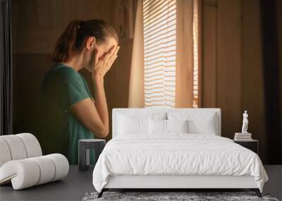 sad unhappy woman in her bedroom suffering from depression, stress, mental health issues  Wall mural