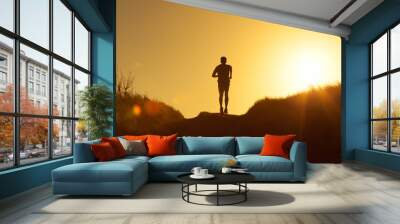 Silhouette of man running.  Wall mural