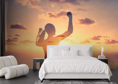 Strong confident, and fit woman flexing her arms up to the sky. People power, and strength concept.  Wall mural