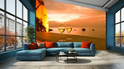 Wine and a beautiful sunset ocean view. Romantic vacation setting.  Wall mural