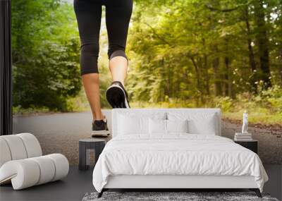 woman taking a walking running on a country road. people fitness nature concept. Wall mural