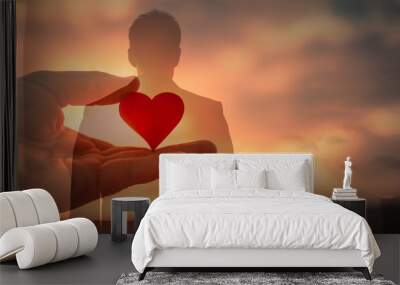 Young man with love and compassion in his heart  Wall mural