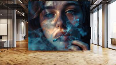 A close-up of the face and lips of an attractive woman smoking, with smoke coming out from between her teeth. She has blue eyes. Wall mural