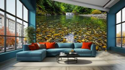 A serene river in the Pacific Northwest wilderness, surrounded by lush greenery and rocky banks, with pebbles scattered on its bottom Wall mural