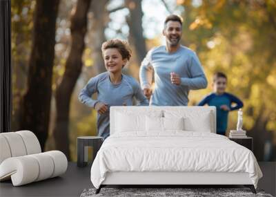 Cheerful active family jogging in public park together having fun lifestyle Wall mural