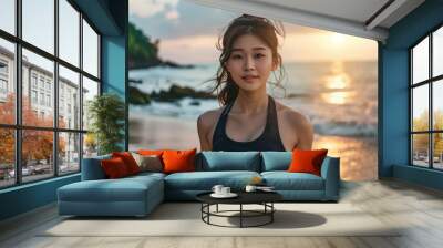 Picture of young attractive asian fitness girl jogging with sea on background Wall mural