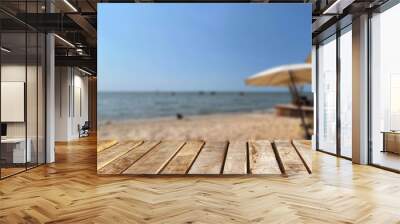 Wooden table top on the beach or sea.Party on the beach  sunset time concept.For montage product display or design key visual layout.View of copy space. Wall mural