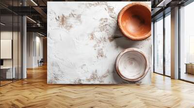 A collection of handcrafted pottery bowls in various sizes arranged on a textured surface, ideal for kitchen or decor images. Wall mural