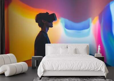 A person immersed in a virtual reality experience, surrounded by colorful abstract backgrounds. Wall mural