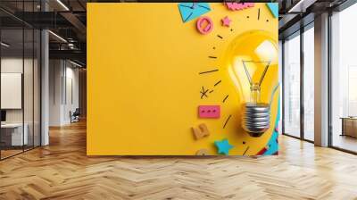 Idea concept with light bulb on yellow background with colorful paper cutouts. Wall mural