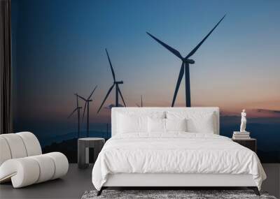 Large wind turbines generate clean energy at sunset Wall mural