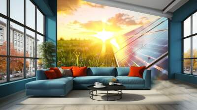 Solar panel amidst green grass, bathed in the soft light of the setting sun, illustrating the beauty of alternative energy sources and eco-friendly electricity in a natural landscape Wall mural