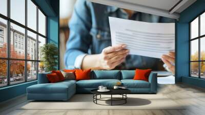 Woman reading a document or letter Wall mural