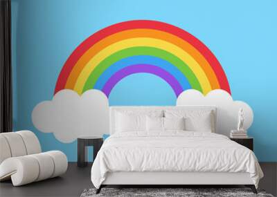 Simple colorful cute rainbow vector illustration. Rainbow with two white clouds on light blue background. Wall mural