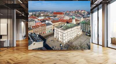 Old town hall of Kazimierz town, then the Jewish district of Krakow, Poland, situated at Wolnica Square. Wawel Castle, St Catherine church, Skalka church and monastery in the background. Aerial view Wall mural