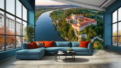 Tyniec near Krakow, Poland. Benedictine abbey, monastery and church on the rocky cliff and Vistula river. Aerial view at sunset. Bielany monastery far in the background Wall mural