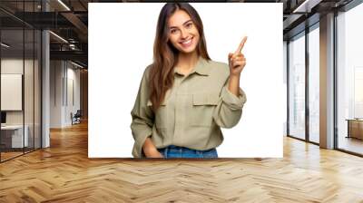 Smiling woman pointing up in casual outfit transparent background Wall mural