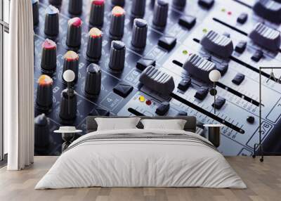 Audio mixing console in a recording session. shallow depth of field. Wall mural