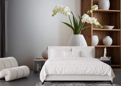 A modern white ceramic vase with minimalist design on a wooden shelf, with a soft-focus background of a stylish living room. Ai generated image. Wall mural