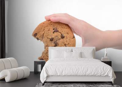 child holding a chocolate chip cookie isolated white background Wall mural