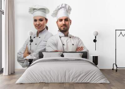 A dynamic image of a female and male chef standing together against a white background, perfect for culinary promotions.  Wall mural