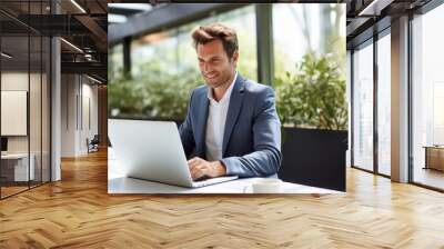 Id=9136728 a portrait photo of a midyears person looking at the laptop, on a sunny day, in the office Wall mural