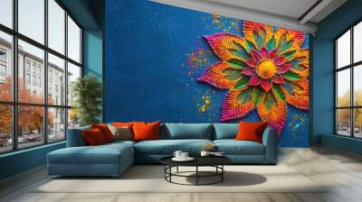 top view Diwali rangoli with colorful powders on a solid blue background with ample copy space. Wall mural