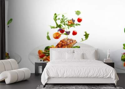 floated Grilled salmon on fresh vegetables falling into a plate isolate on transparency background PNG Wall mural