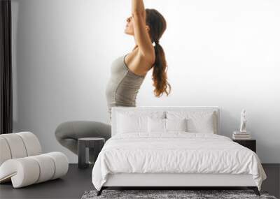 Young woman practicing yoga on yoga mat side view full length isolate on trasparency background PNG Wall mural