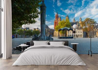 Maastricht, Netherlands 10-24-2022 An empty vrijthof square in downtown Maastricht with a dramatic cloudscape and the typical skyline withthe Servaas baslicia, red tower of Sint Jan and Perroen statue Wall mural