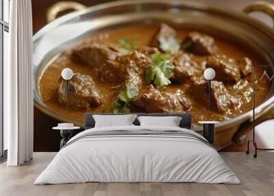 A bowl of rich, savory meat curry garnished with fresh cilantro. Wall mural