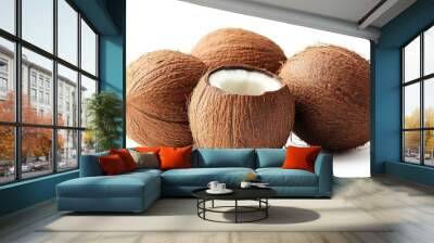 A group of coconuts, one cut open to reveal the white flesh inside. Wall mural