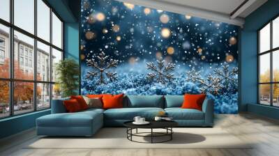 A serene winter scene with snowflakes falling over a blue landscape, creating a festive atmosphere. Wall mural