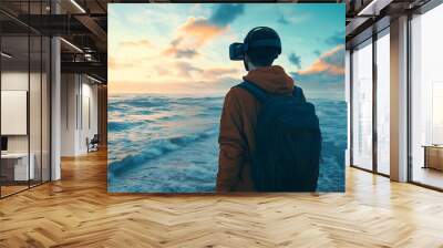 A young man wearing VR headset with backpack looking at ocean view. Wall mural