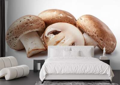 Close-up of three whole button mushrooms, one sliced in half, on a white background. Wall mural