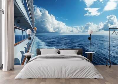 Cruise ship sailing on the ocean with white clouds and blue sky. Wall mural