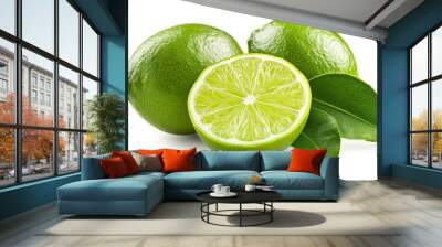 Three limes, one cut in half, showcasing vibrant green color and fresh leaves. Wall mural