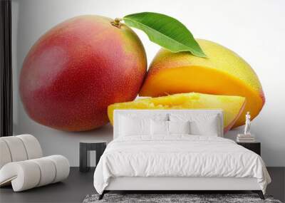 Two whole mangoes and a slice, one cut in half, on a white background. Wall mural