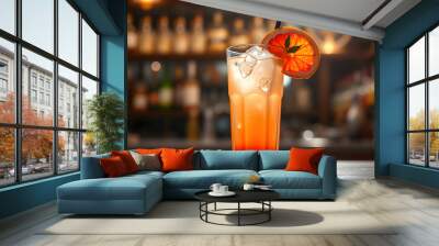 Closeup glass of greyhound cocktail decorated with grapefruit at bright bar counter background isolated with white highlights, png Wall mural