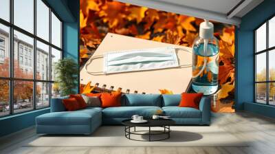 Notebook with a mask and a sanitizer bottle in Autumn isolated with white highlights, png Wall mural