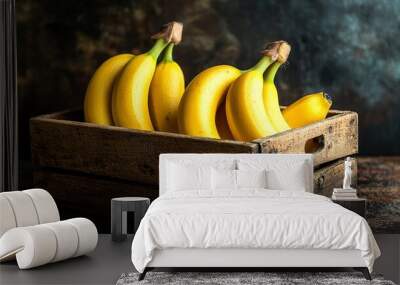 Bananas in wooden crate with rustic dark background and natural light Wall mural