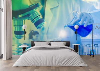 Close up, scientist dropping blue liquid into test tubes,   concept of laboratory equipment in science experiments. Wall mural