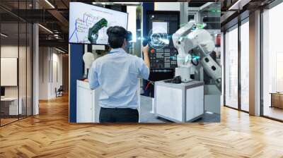 Engineer testing virtual reality glasses 3D scan with joystick programming automated robot industry in smart factory, Technology 4.0 concept Wall mural