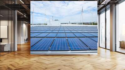 Solar panels on factory roof with wind turbine Wall mural